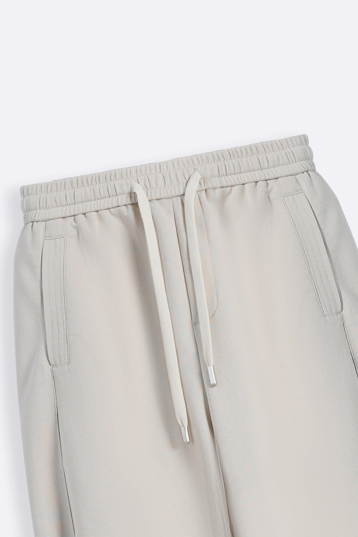BEIGE PANELLED BARREL PANTS