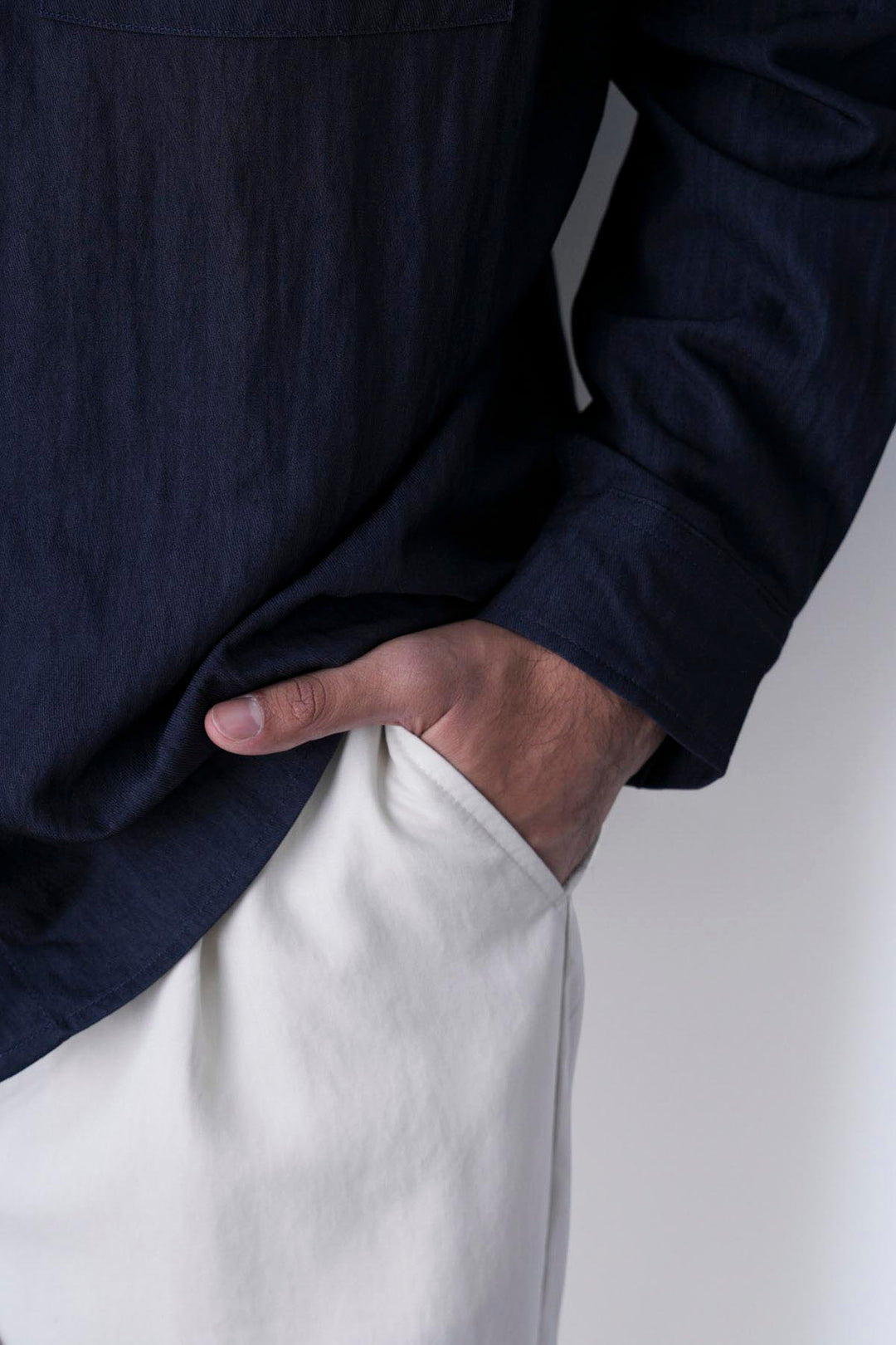 IVORY RELAXED FIT PLEATED PANTS