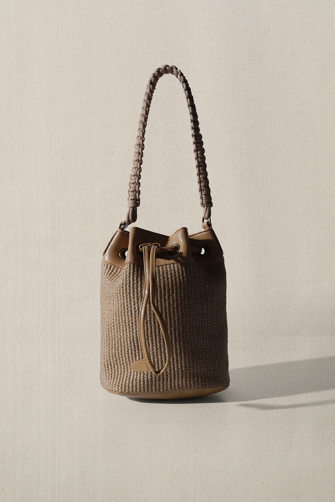 LIGHT BROWN THE CARAVAN BUCKET BAG