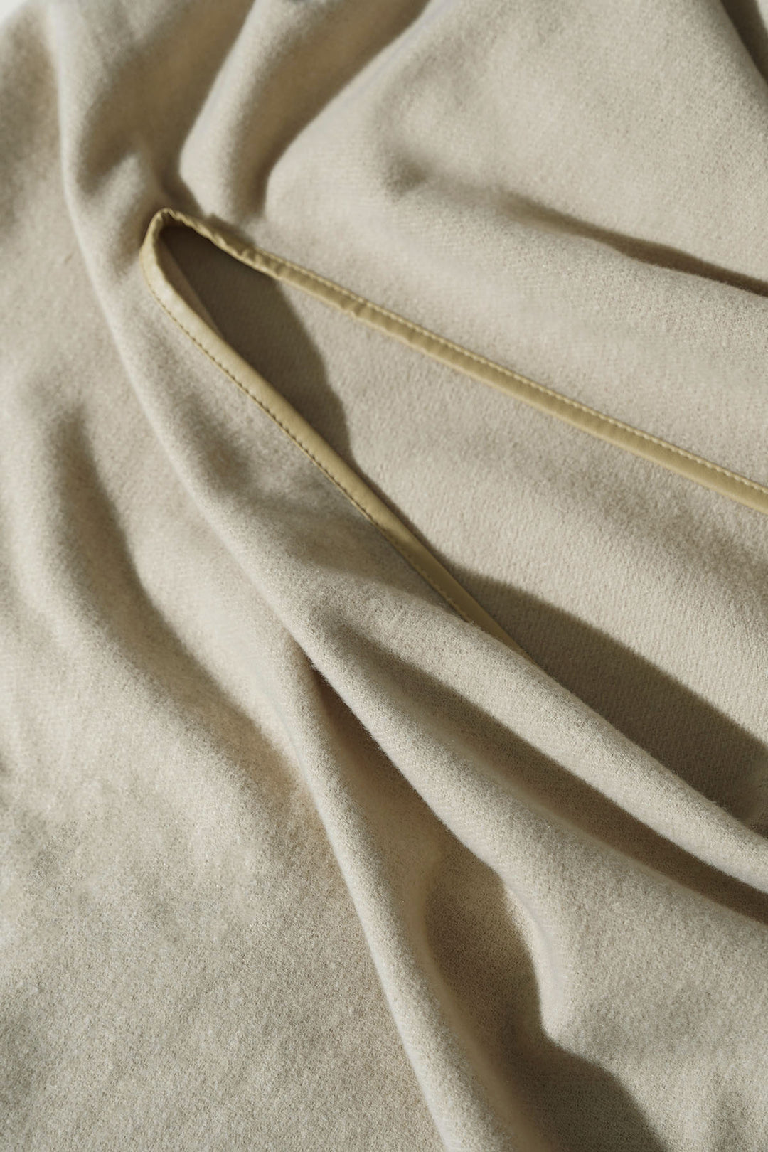 CREAM EDGE LINED CAPE