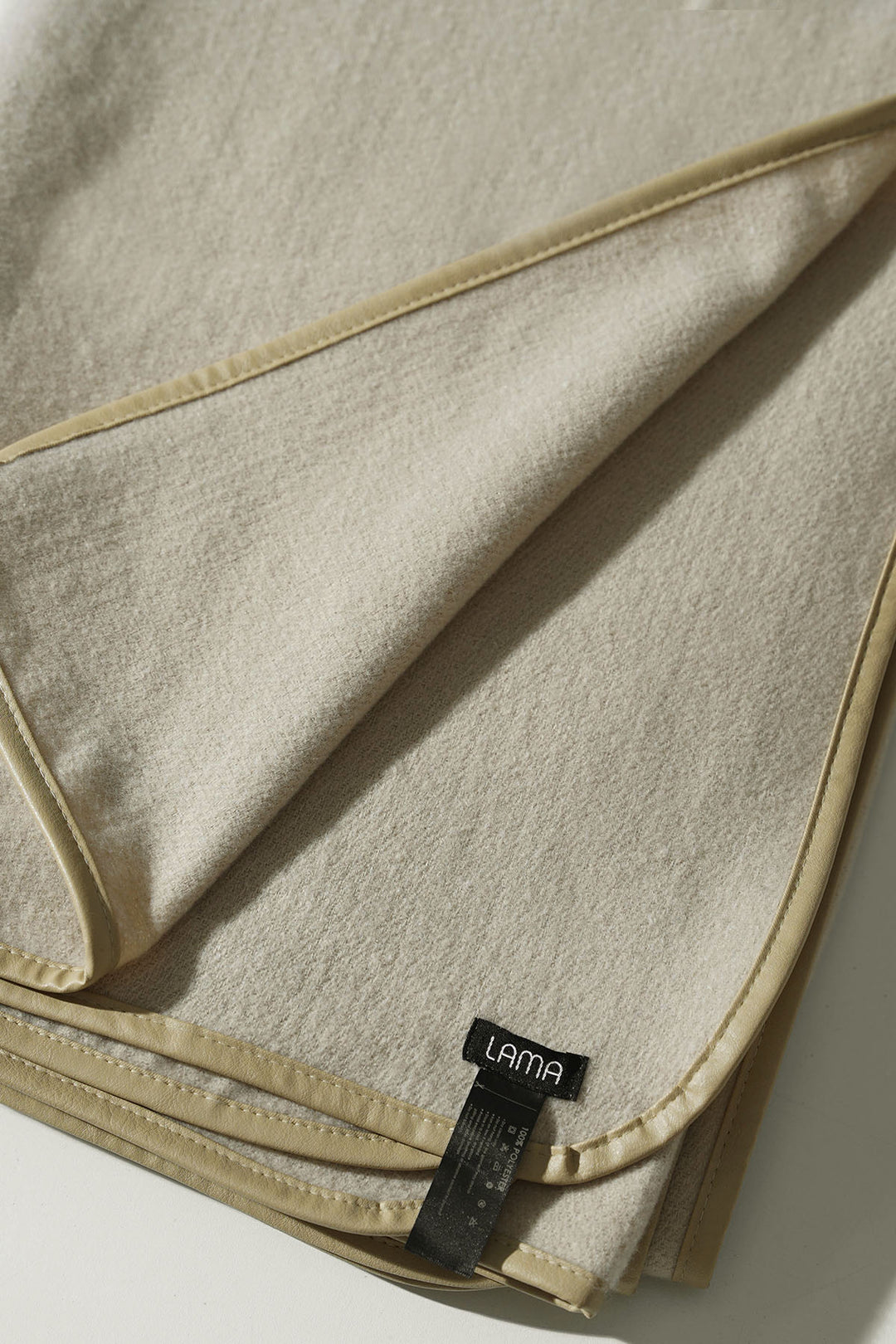 CREAM EDGE LINED CAPE