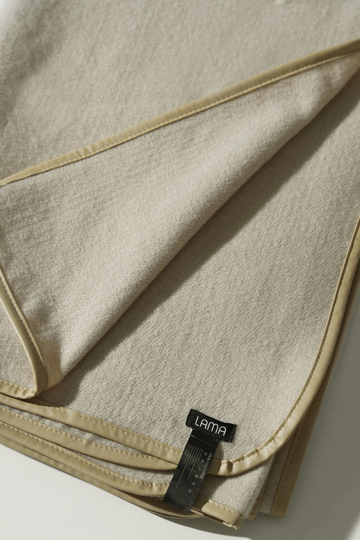 CREAM EDGE LINED CAPE