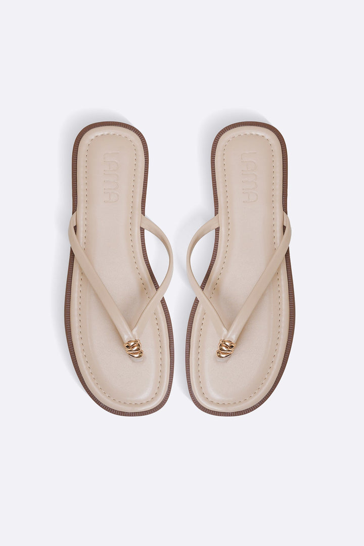 BEIGE STUD STUFF FLIP FLOPS