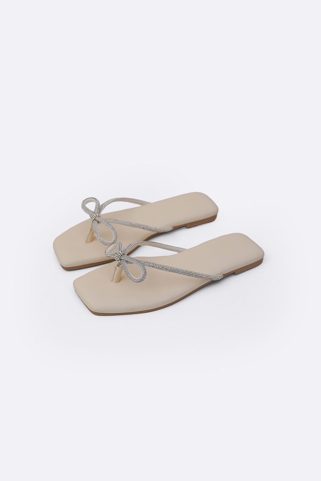 CREAM BOW FLIP FLOPS