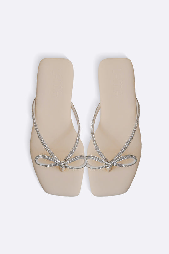 CREAM BOW FLIP FLOPS