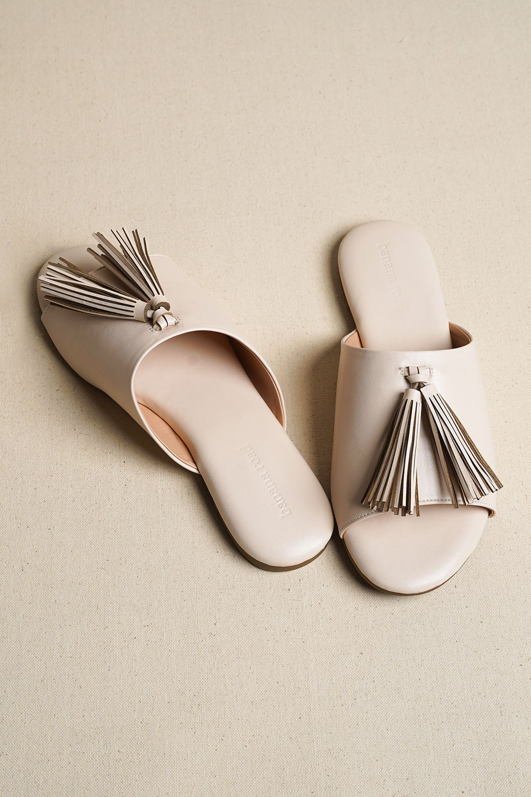 OFF WHITE TROPIC TASSEL SLIDES