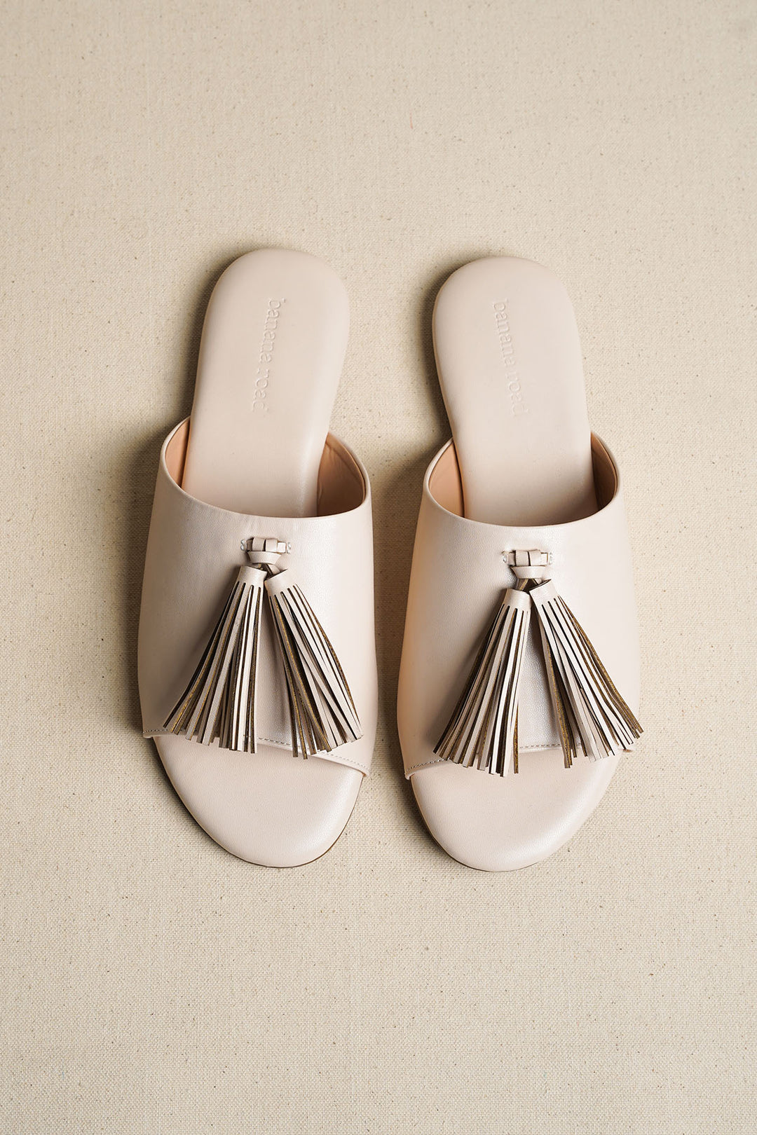 OFF WHITE TROPIC TASSEL SLIDES